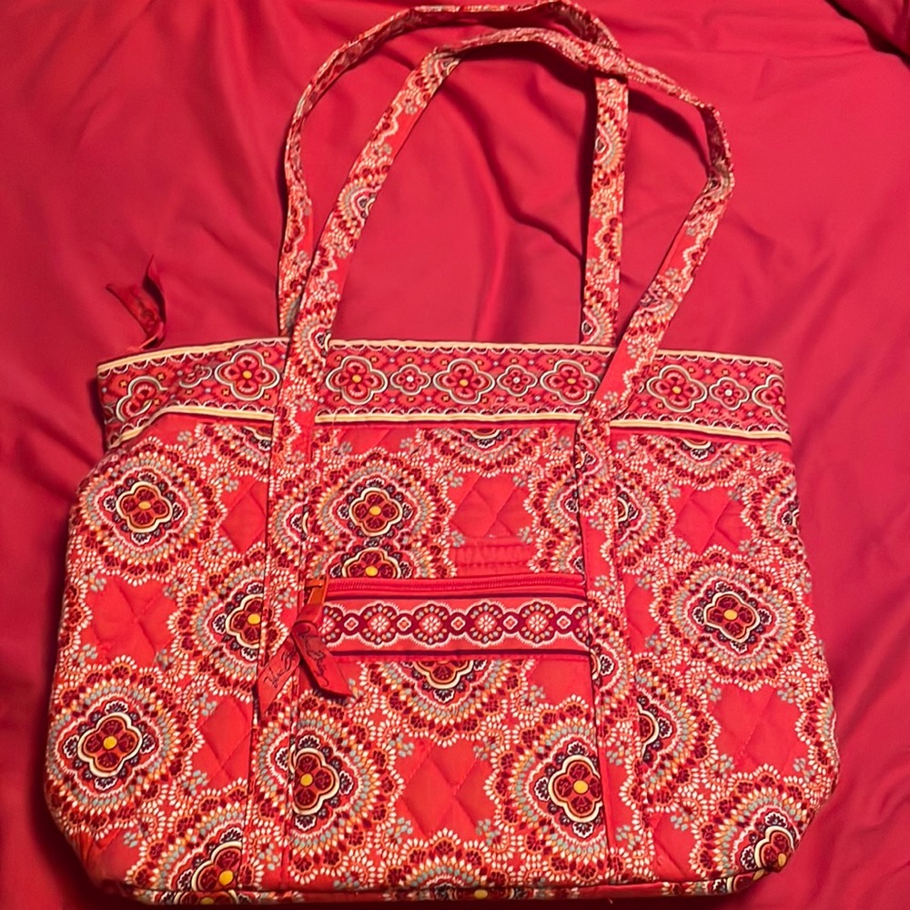 Vera Bradley 2 strap top zipper tote with 6 interior pockets. New condition
